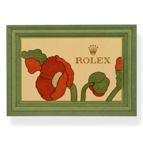  Escaparate ROLEX decorado con flores en tonos verdes, ocres y beige, años aproximados 2000 -2010.