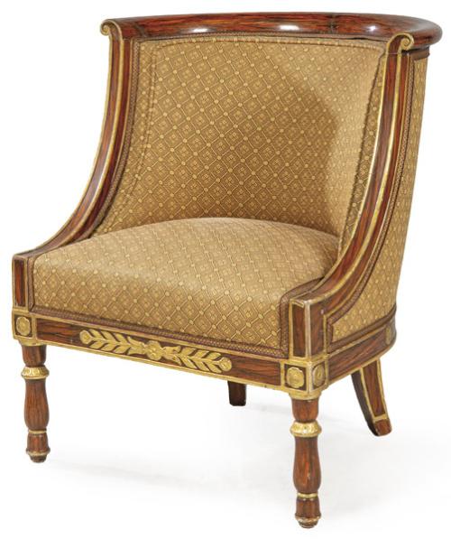 Bergère de estilo imperio en madera de palisandro tallada y parcialmente dorada. Con tapicería de motivos geométricos. Finales S. XIX