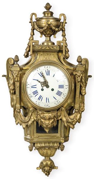  Reloj cartel de pared estilo Luis XVI en bronce dorado con máscara de león.