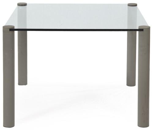  Mesa, con sobre de vidrio transparente y estructura de cuatro patas cilíndricas de metal pintado.