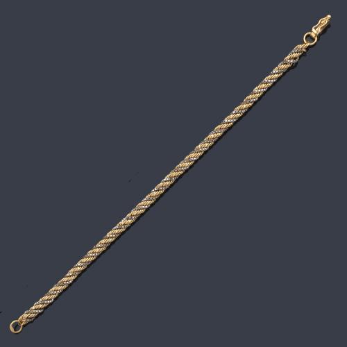  Pulsera tipo cordón en oro amarillo y blanco de 18 K