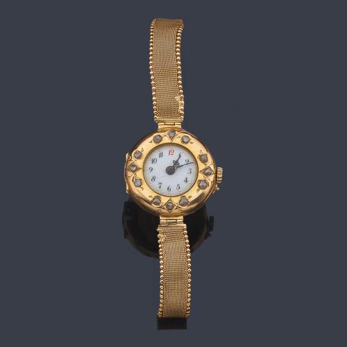  Reloj de señora con caja y brazalete en oro amarillo de 18 K. Principios de siglo XX.