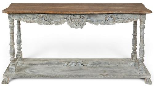  Consola, con tapa rectangular en madera sin tratar, sobre patas torneadas unidas en la base por un estante y en la parte superior faldón tallado y recortado en madera pintada.