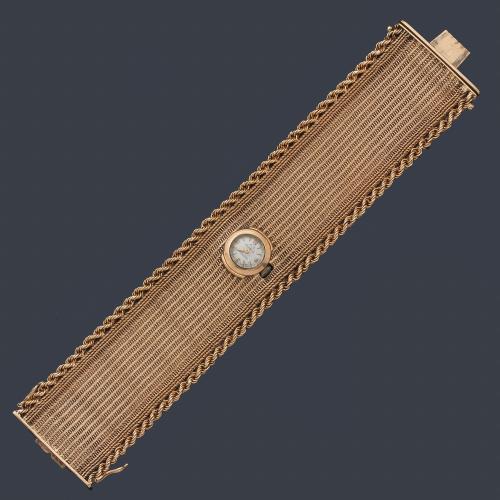  Reloj pulsera en malla de oro rosa de 18K con detalle en cordoncillo de oro amarillo de 18K.