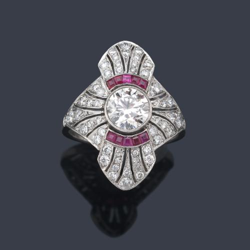 Anillo lanzadera con brillante central de 1,00 ct y resto de diamantes de aprox. 0,80 ct en total y rubíes calibrados.