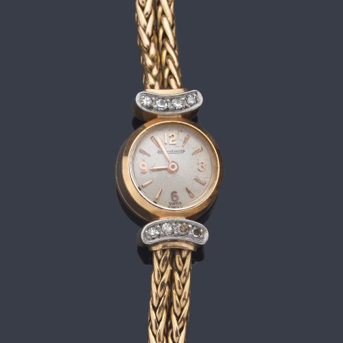  JAEGER LE COULTRE de señora con caja y brazalete en oro amarillo de 18 K. con diamantes.
