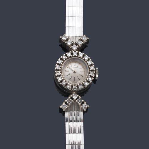  UNIVERSAL, reloj de señora con caja en oro blanco de 18 K y orla de brillantes.