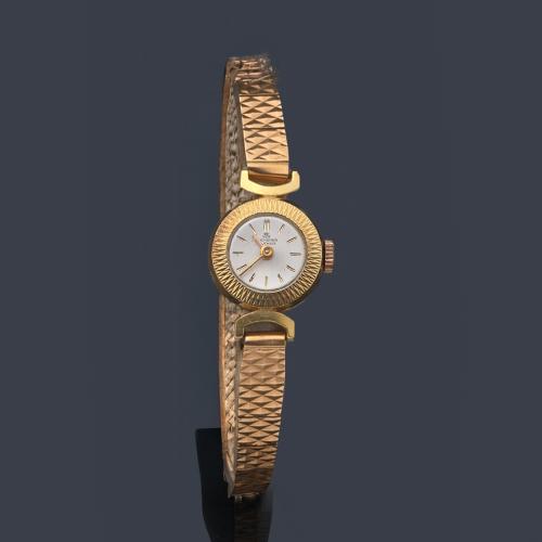 BUCHERER de señora con caja y brazalete en oro amarillo de 18 K.